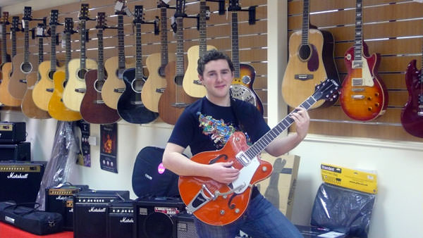 P1040341 Daniel Corrigan of local band LoUiSe looks at the range of guitars at the new Music City shop located at Dungannon Enterprise Centre.